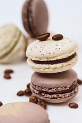 Few colored macarons on a white background