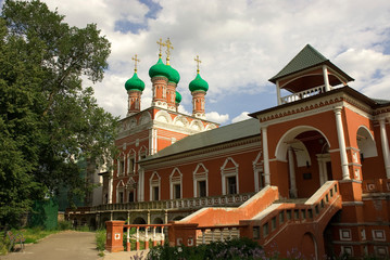 Fototapeta na wymiar Russia. Moscow. Petrovsky district. Upper St. Peter Monastery. Green onion domes.