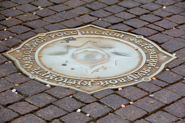 Russia, Moscow, Red Square. Bronze compass that marks the symbolic zero point from which all roads in Russia are measured, good luck coins. 