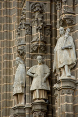 Fototapeta premium Spain, Castilla-La Mancha,Toledo. Statues on exterior church walls.