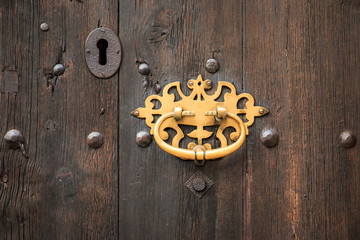 Spain, Balearic Islands, Mallorca, wooden doors with brass ring door pull.