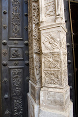 Spain, Castilla-La Mancha,Toledo. Toledo Cathedral, 13th-century Gothic. Church detail around historic ornate doorway.