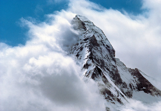 Switzerland, Matterhorn. Clouds swirl around the Matterhorn above Zermatt, in the Valiasian Alps in Switzerland.