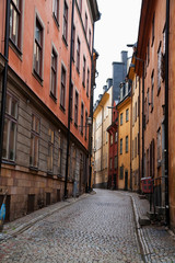 Fototapeta na wymiar Stockholm, Sweden - A narrow alley going between two old world buildings.
