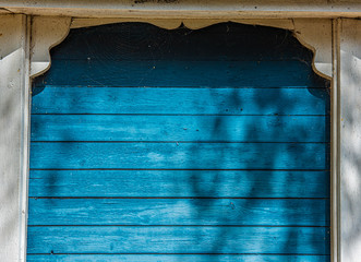 A narrow blue wooden wall.