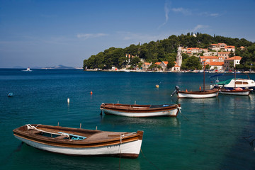 Fototapeta na wymiar Small boats docked in harbor, Hvar Island, one of the most famous Dalmatian Islands, Croatia