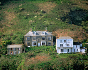 Fototapeta na wymiar England, Pt. Isaac. These stately homes overlook the small harbor at Pt. Isaac in Cornwall, England.