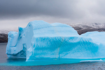Greenland. Northeast Greenland National Park. Kong Oscar Fjord. Iceberg showing an interesting melting pattern.