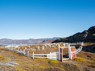 The cemetery. Inuit village Oqaatsut (once called Rodebay) located in the Disko Bay, Greenland,...