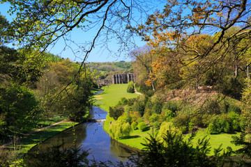 England, North Yorkshire, Ripon. Fountains Abbey, Studley Royal. UNESCO World Heritage Site. National Trust, Cistercian Monastery. River Skell and Surprise view.