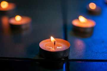 Row of the candles on the tile