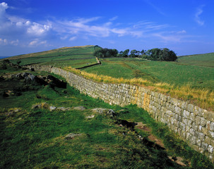 England, Hadrian's Wall. The stones of Hadrian's Wall, a World Heritage Site completed in 123 A.D., meld with the green fields of Northumberland, England.