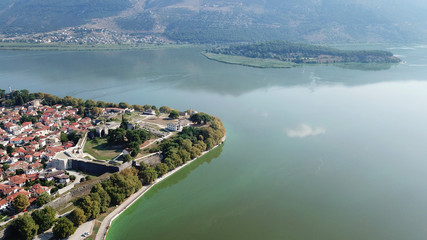 Aerial drone bird's eye view photo of iconic city and castle and mosque of Ioannina surounded by famous lake and mountains of Pindus, Epirus, Greece