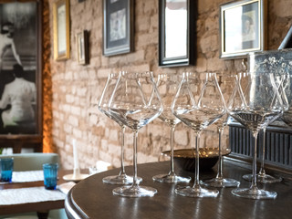 Empty wine glasses are served on the table