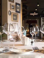 Empty wine glasses are served on the table