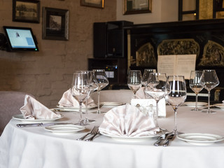 Empty wine glasses are served on the table