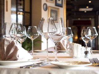 Empty wine glasses are served on the table