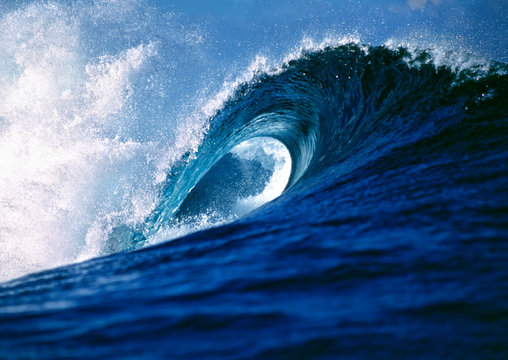 Fiji Islands, Tavarua, Cloudbreak. A wave creates a perfect curl at Cloudbreak near Tavarua, Fiji Islands.