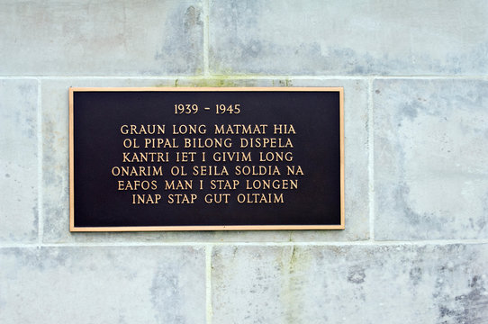 Papua New Guinea, Lae. World War II Memorial Plaque In Pidgin.