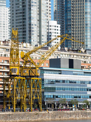 The old cranes at the old docks. Puerto Madero, the modern living quarter around the old docks of Buenos Aires, capital of Argentina.