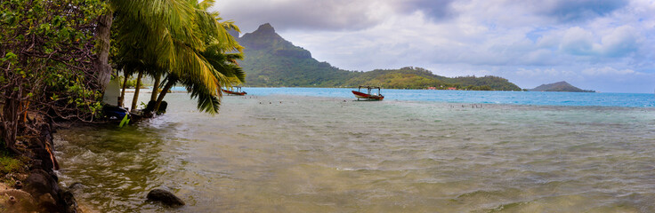 Panorama. lagoon view with moored boats. Bora Bora. French Polynesia.