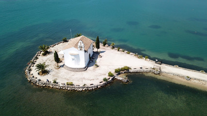 Aerial drone photo of iconic church of Ypapanti built in a small piece of land in bay of Gouvia, Corfu island, Ionian, Greece