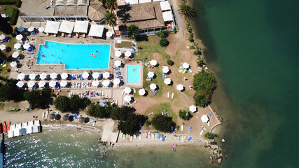 Fototapeta na wymiar Aerial drone photo of resort near famous tropical bay of Nisaki a popular yacht dock, island of Corfu, Ionian, Greece