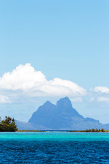 Pacific Ocean, French Polynesia, Society Islands, Leeward Islands, Bora Bora. Scenic view of extinct volcano and peaks of Mount Otemanu and Mount Pahia.
