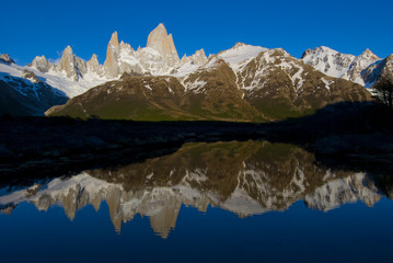 Cerro Fitzroy at sunrise with reflection in pothole lake, Los Glaciares National park, near El...
