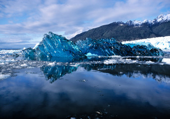 Chile, San Rafael Lagoon NP. The underside of a newly-calved iceberg looks like blue, scalloped glass in San Rafael Lagoon NP, Chile.