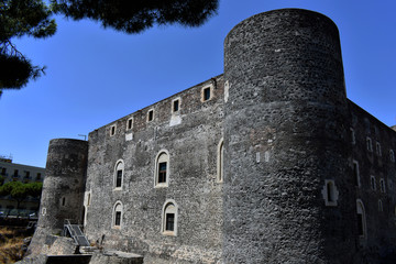 Side view of the grey-brick medieval castle Castello Ursino (Castello Svevo) in Catania with the...