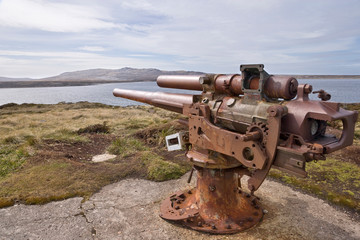South Atlantic, Falkland Islands, Stanley. Rusting gun battery points at Gypsy Cove. 