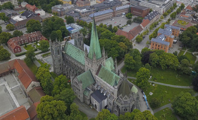 Nidaros Cathedral or Nidarosdomen or Nidaros Domkirke is a Church of Norway cathedral located in the city of Trondheim, Norway. Aerial view from drone. July 2019