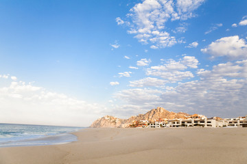 Fototapeta na wymiar Cabo San Lucas, Baja California Sur, Mexico - An exterior view of a tropical resort on the beach.