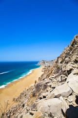 Fototapeta na wymiar Cabo San Lucas, Baja California Sur, Mexico - A beach with a large rock formation.