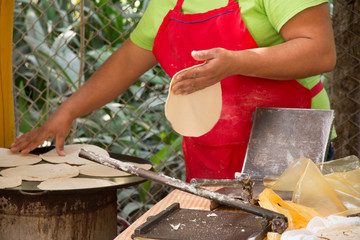Mexico, Bahia de Banderas, Bucerias. A beach town in Nayarit State between La Cruz de Huanacaxtle and Nuevo Vallarta. The Tianguis (Market) de Domingo 'Sunday Market'. Tortillas being prepared.