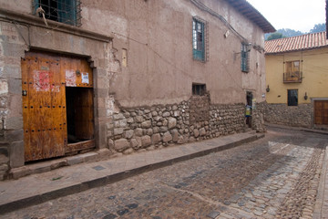 South America - Peru. Old Inca wall foundation along cobblestone street in Cusco.