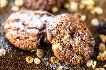 cookies with icing sugar and wood background