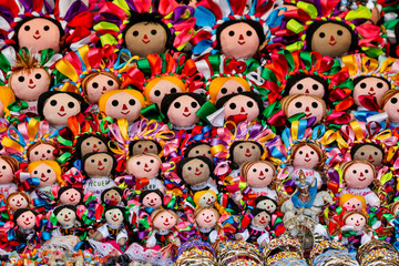 Fototapeta na wymiar Guanajuato in Central Mexico. Vendor display colorful dolls for sale