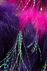 USA, Alaska, Lake Clark National Park. Close-up of pink, silver and purple fishing fly details at Silver Salmon Creek Lodge.