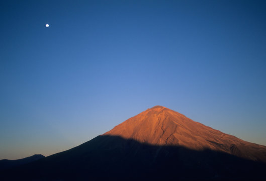 Peru, Andes, Volcan Misti with moon, volcano above Arequipa, 5825 meters.
