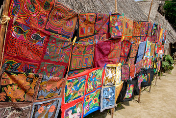 Central America, Panama, San Blas Islands (aka Kuna Yala). Colorful Kuna Indian hand stitched molas on display. - obrazy, fototapety, plakaty