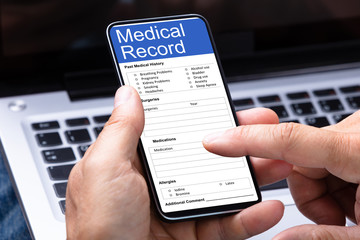 Man Booking Hotel Using Smartphone