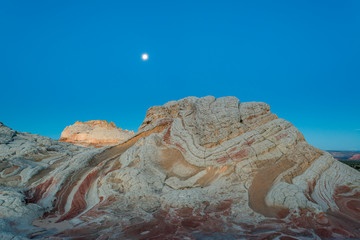 Moon at sunrise, Vermillion Cliffs, White Pocket wilderness, Bureau of Land Management, Arizona.