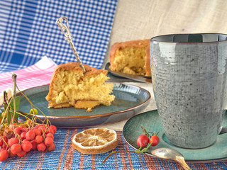 Cup of black tea.And Apple sponge cake.