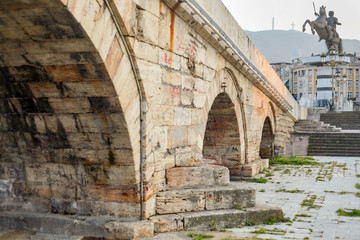 Skopje,Stone Bridge, low angle,towards steps with statue of warrior on horse in background.