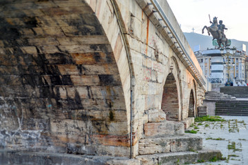 Skopje,Stone Bridge, low angle,towards steps with statue of warrior on horse in background.
