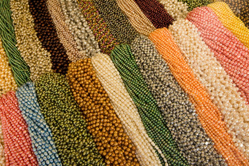 USA, California, San Francisco. Colorful beaded necklaces on display in market.