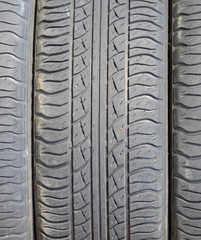 The background of the tread pattern of the car wheel. Rubber tir