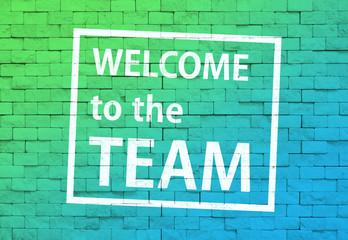 Fototapeta premium 壁に書かれた「Welcome to the TEAM!」